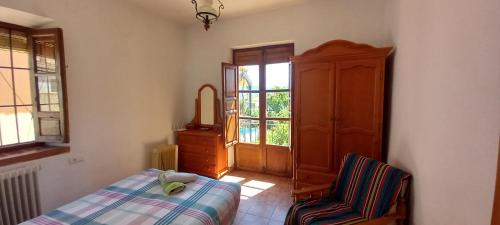 En eller flere senge i et værelse på Casa Tia Maria, Acequias