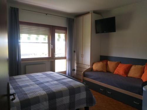 Postel nebo postele na pokoji v ubytování B&B DA ROBERTINO