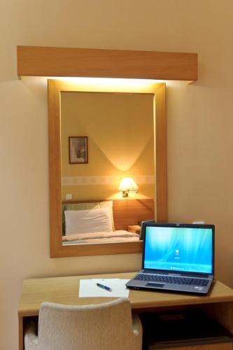 a laptop computer sitting on a desk in a hotel room at Anesis in Kastoria