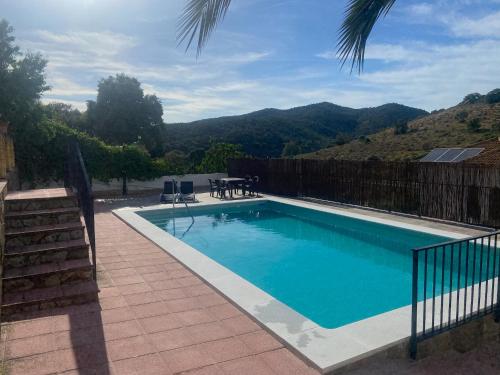 a swimming pool with a view of a mountain at Casa San Rafael con piscina in Córdoba