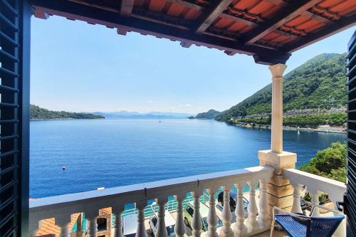 a view of the water from a balcony at By the sea in Sobra