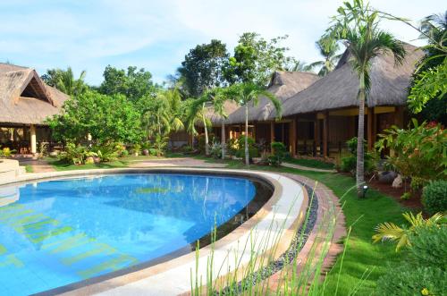 an image of a resort with a swimming pool at Veraneante Resort in Panglao