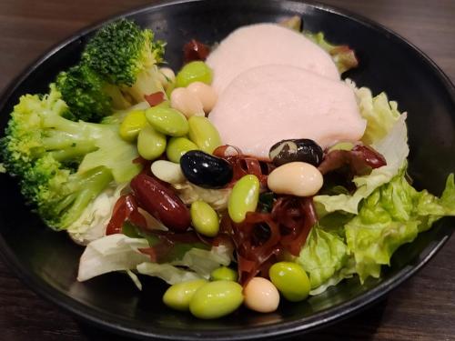 a plate of food with broccoli and meat and vegetables at APA Hotel TKP Tokyo Nishi-Kasai in Tokyo