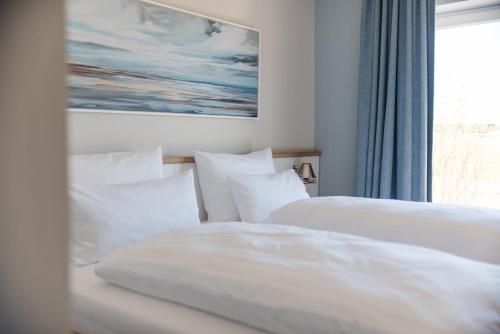 Una cama o camas en una habitación de Seaside 43