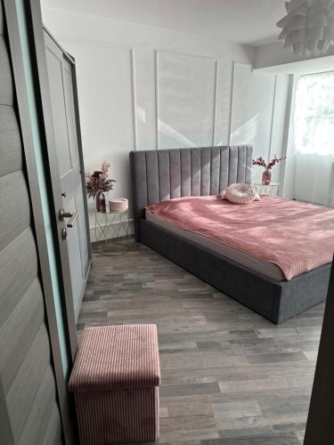 Posteľ alebo postele v izbe v ubytovaní Apartament AME
