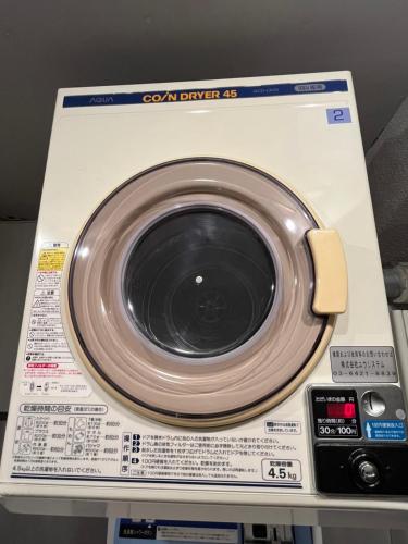 a close up of a washing machine at Rhodes Otsuka Hotel in Tokyo