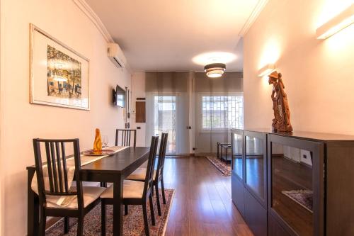 a dining room with a wooden table and chairs at Sant'Ivo Apartments in Rome