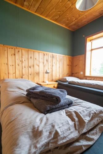 Voodi või voodid majutusasutuse Hengifosslodge Skáldahús toas
