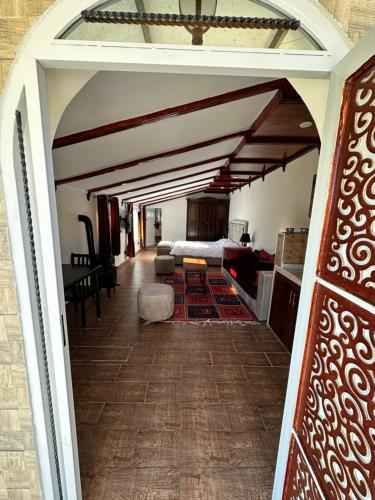 a hallway leading to a bedroom with a bed at ATGAL Ferme D'hote in Azrou