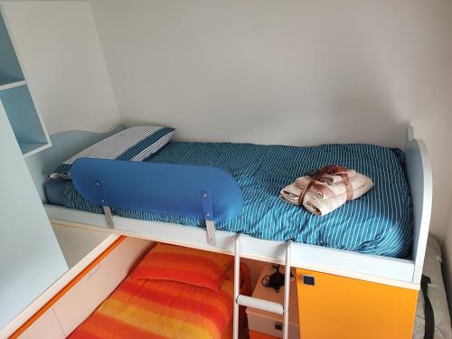 a small bed in a small room with at Il Riccio del Castagno in Novaledo