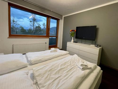 Postel nebo postele na pokoji v ubytování Apartmán v srdci Beskyd - Čeladné