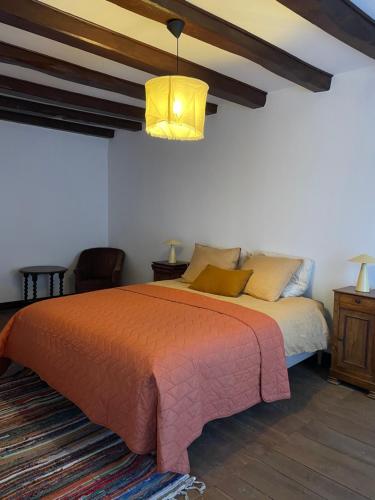 Postel nebo postele na pokoji v ubytování Auberge du Boisné