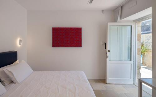 Cama o camas de una habitación en Dimora San Giuseppe Hotel & SPA
