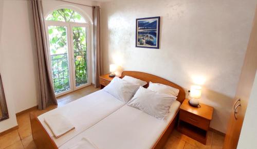 Postel nebo postele na pokoji v ubytování Apartments Marino