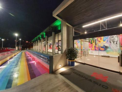 a bowling alley with a colorful lanes at night at Morros del Pacífico in Pichilemu