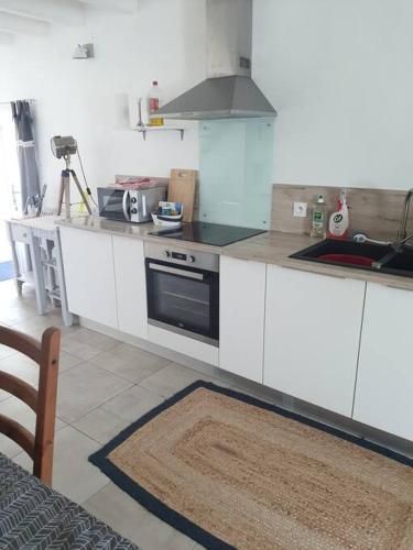 Kuchyňa alebo kuchynka v ubytovaní Appartement duplex 4 personnes