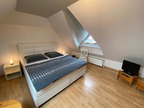 Кровать или кровати в номере Haus Blaubär