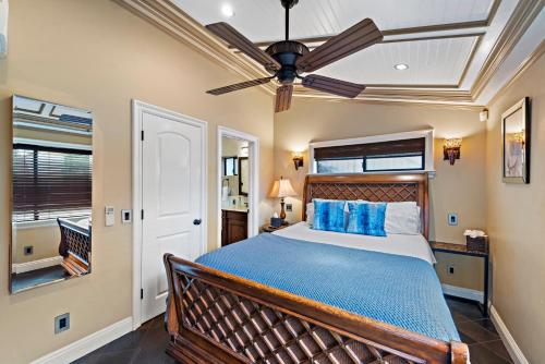 a bedroom with a bed and a ceiling fan at Villa Palazzo D'Stella at the Retreat in Laguna Beach