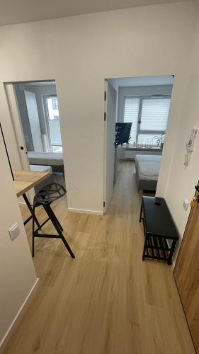 a living room with a couch and a table and two windows at APARTAMENT 4 bed 2 room WARSAW in Warsaw