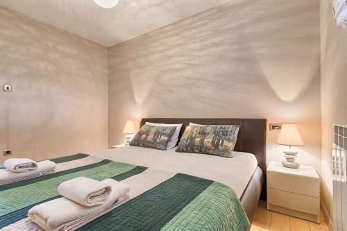 a bedroom with two beds with towels on them at Apartment Fran in Banjole
