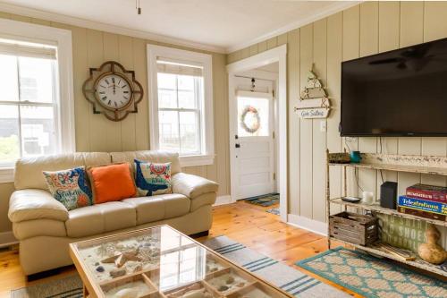 a living room with a couch and a fireplace at The Seaport House - Near Newport in Bristol