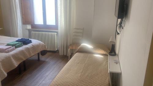 Posteľ alebo postele v izbe v ubytovaní affittacamere alloggio olivo