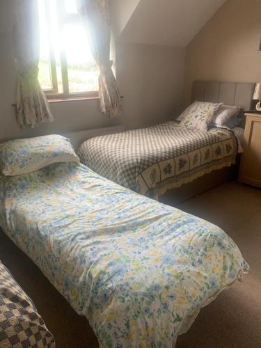 Heathergate Cottage Dartmoor BnBにあるベッド
