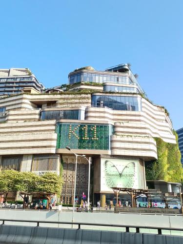 a building with a plant on the side of it at Les Barons in Hong Kong
