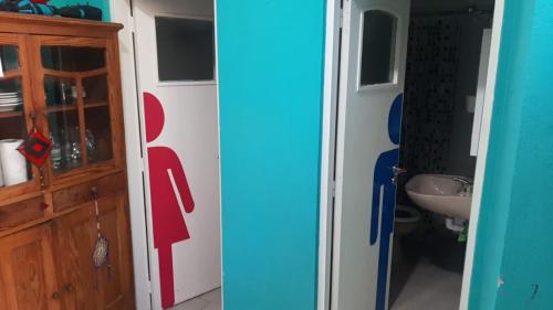 a bathroom with a sink and a toilet and a cabinet at Loft Salta in Bahía Blanca