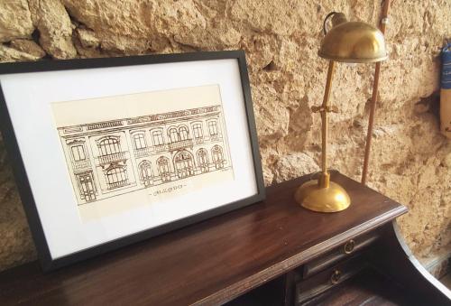 a picture of a building on a table with a lamp at Adara Vegueta Exclusive Apartment in Las Palmas de Gran Canaria