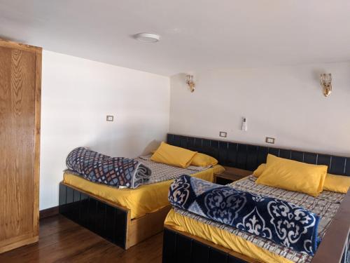 A bed or beds in a room at Al fouad