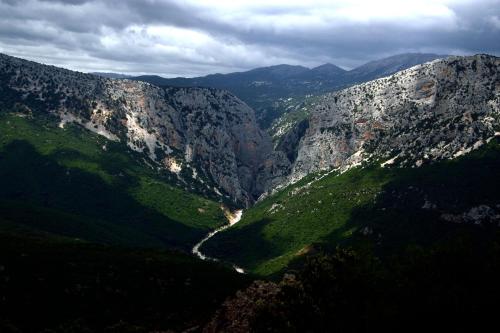 an aerial view of a mountain valley with a river at Marina's apartment Ogliastra in Lotzorai