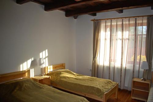 Ένα ή περισσότερα κρεβάτια σε δωμάτιο στο Guest House St. Mária