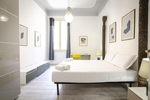 Ένα ή περισσότερα κρεβάτια σε δωμάτιο στο Dimora Fossalta, a pochi passi da Piazza Maggiore