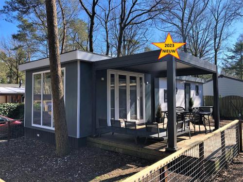 a tiny house with a star sign on it at Luxe Chalet Leeuwenhart - recreation only in Hoenderloo