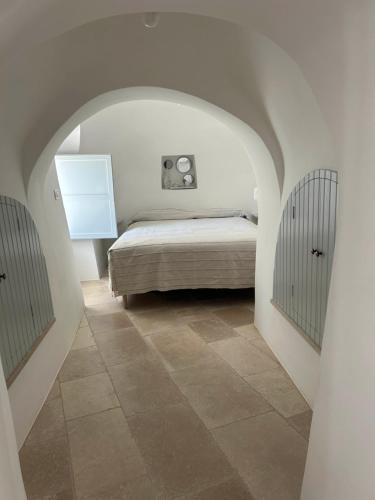 Postel nebo postele na pokoji v ubytování Il trullo di simona