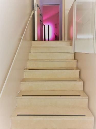 a stairway with wooden steps in a house at Hotel Casa Poli in Mantova