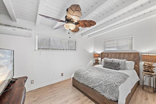 a bedroom with a bed and a ceiling fan at Sleepy Hollow Villas #2 in Laguna Beach in Laguna Beach