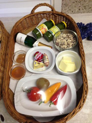 a basket of food with vegetables and other food items at Ferienhaus Troadkasten - Familie Friedrich in Bad Waltersdorf