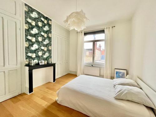 Posteľ alebo postele v izbe v ubytovaní La Maison Faidherbe, Malo-les-bains