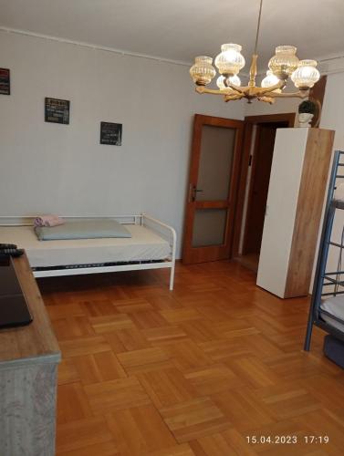 a room with a bed and a wooden floor at Graz-Apartments 01 in Graz