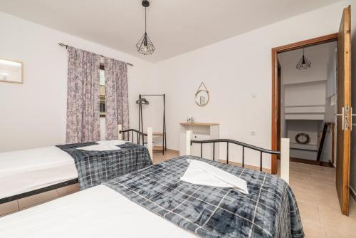 A bed or beds in a room at traditional suburbs maisonette