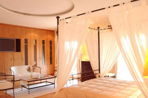Ένα ή περισσότερα κρεβάτια σε δωμάτιο στο Privilege Villas