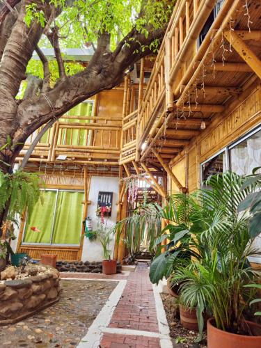 a building with trees and plants in front of it at Tatacoa Star Eco Hotel in Villavieja