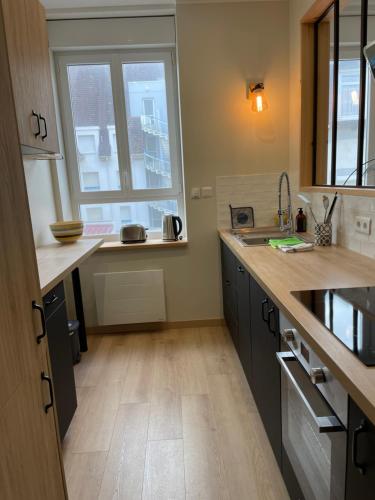 Kuchyňa alebo kuchynka v ubytovaní Appartement Le Fayot