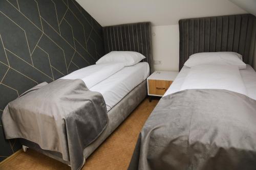 Katil atau katil-katil dalam bilik di Hotel Divanhana