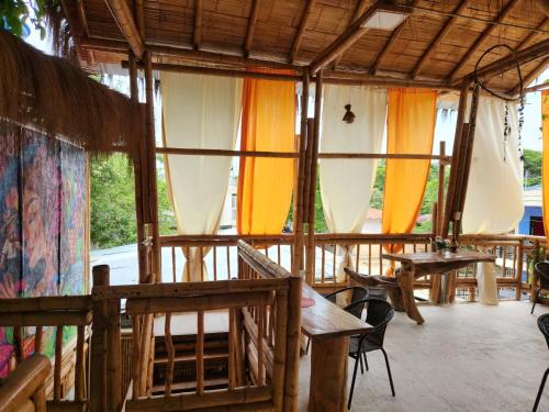 a room with wooden tables and umbrellas at Tatacoa Star Eco Hotel in Villavieja
