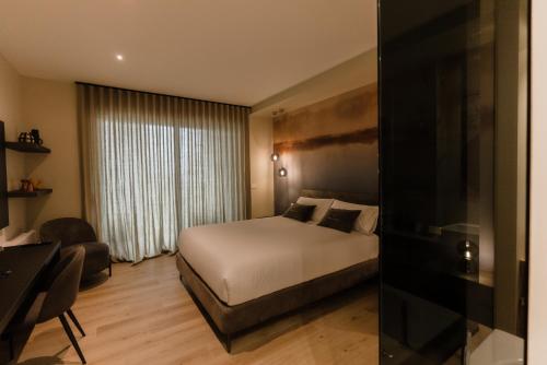 Tempat tidur dalam kamar di 'Tabula Rasa Exclusive Rooms'