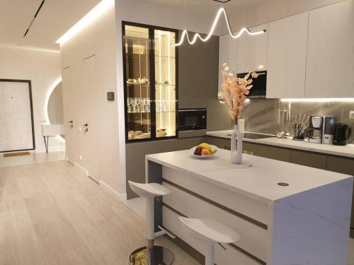 Kuchyň nebo kuchyňský kout v ubytování An apartment that Brings More