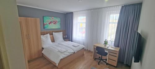 Postel nebo postele na pokoji v ubytování KL Apartments